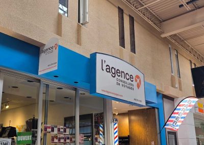 Enseigne L’agence voyage
